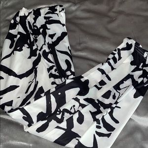 Stylish cow print pants with pockets.